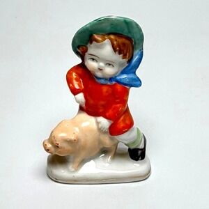 Vintage Japan Porcelain Figurine Boy Riding Pig Green Hat Blue Scarf Orange Coat
